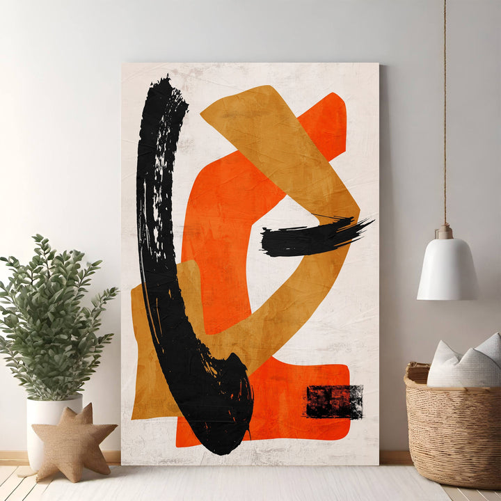 Wadi Home abstract brushstroke wall art with bold orange, ochre, and black strokes on textured neutral background.