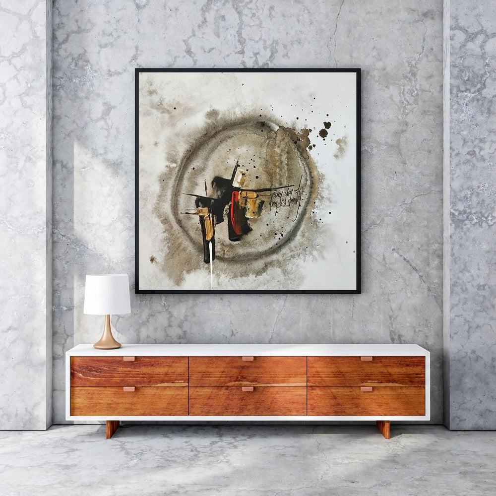Wadi Home abstract circular mixed media wall art in earthy tones with black frame, textured strokes and splatters.