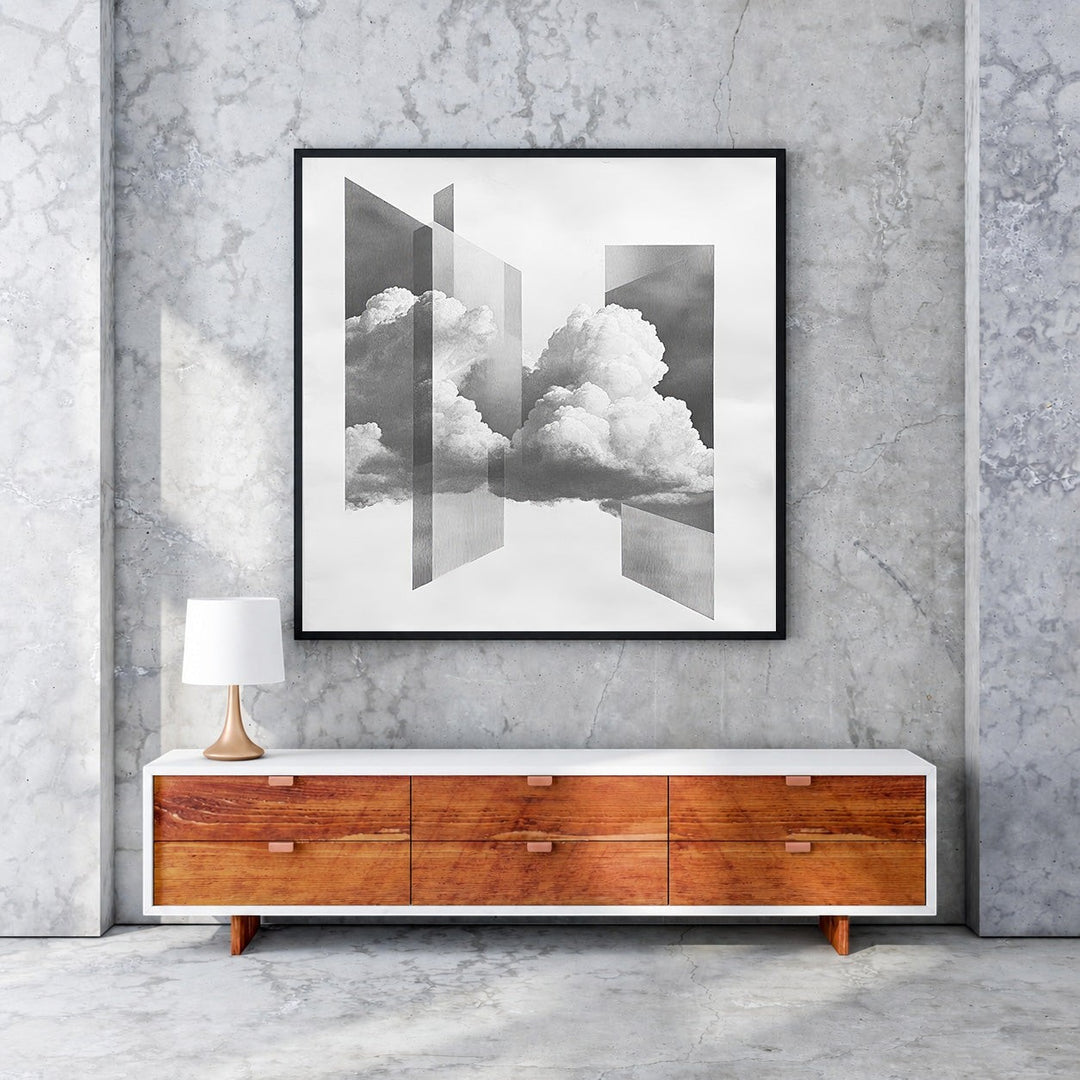 Wadi Home Abstract Cloudscape framed wall art in black frame, featuring monochromatic clouds and geometric shapes.