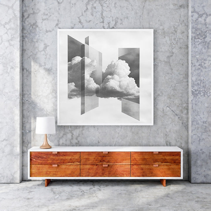 Wadi Home Abstract Cloudscape wall art with geometric shapes and clouds, framed in white, monochromatic.