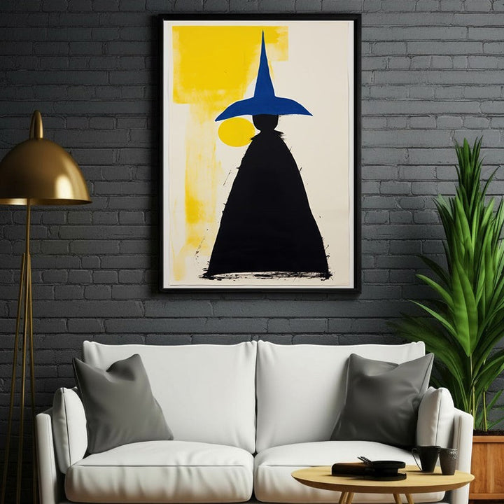 Wadi Home abstract wall art featuring a black silhouette figure wearing a blue pointed hat against a yellow and cream background.