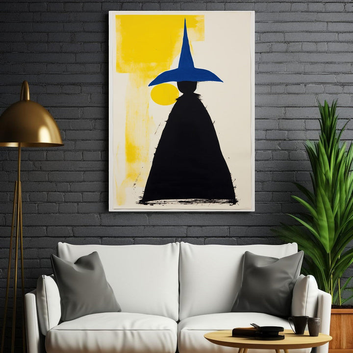 Wadi Home abstract wall art featuring a black figure in a blue pointed hat against a yellow and cream background.