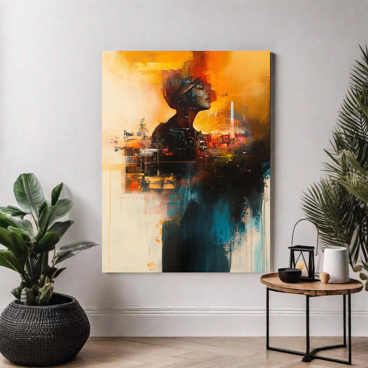 Wadi Home abstract wall art featuring a figure silhouette with cityscape elements in warm oranges, blues, and earthy tones.