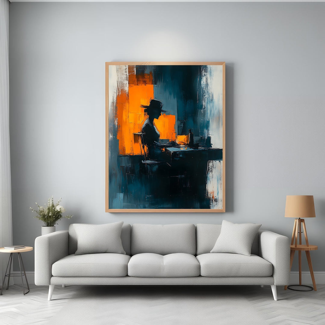 Wadi Home abstract wall art featuring a silhouetted figure at a desk, with bold strokes of deep blue, orange, and white.