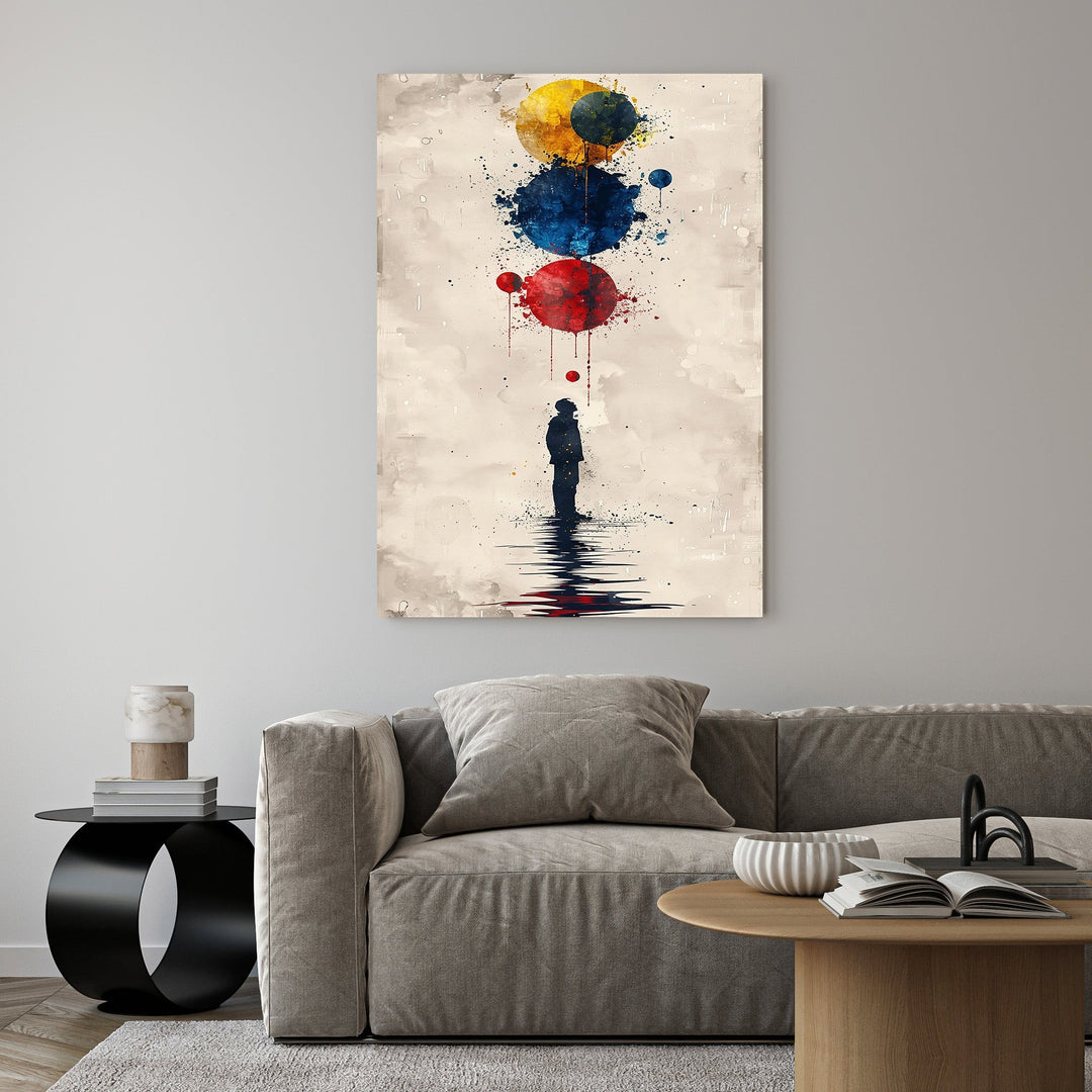 Wadi Home abstract wall art with silhouette figure gazing at red, blue, and yellow watercolor orbs.