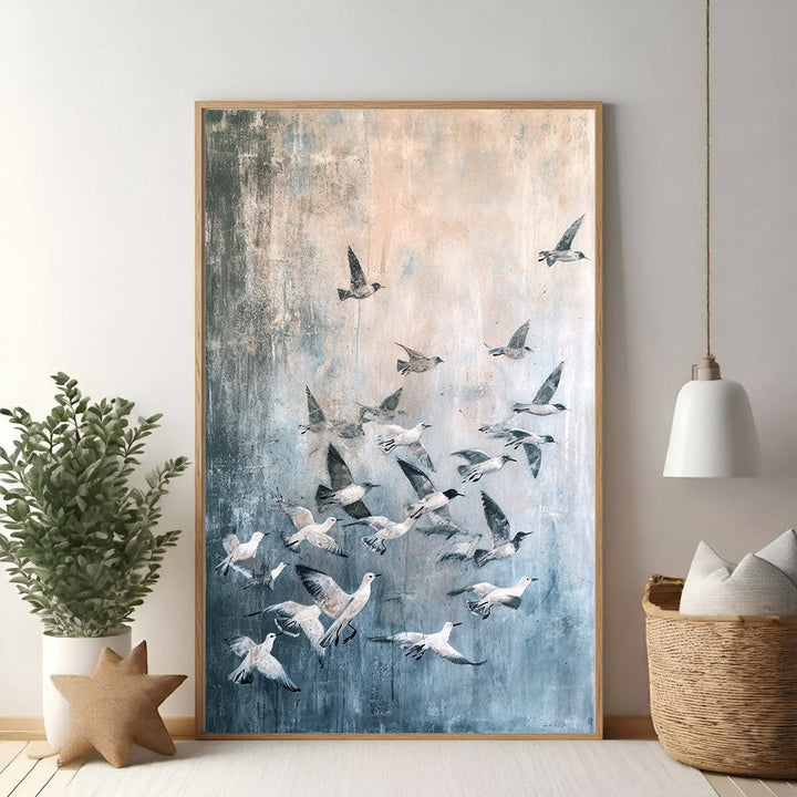 Wadi Home abstract wall art featuring a flock of birds in flight, with blues, grays, and peachy tones.