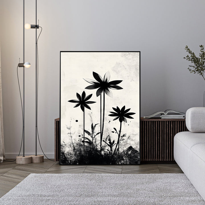 Wadi Home abstract floral silhouette wall art in black and white, featuring graphic flowers on a textured neutral background.