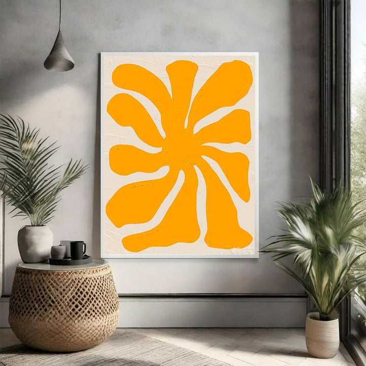 Wadi Home abstract floral burst wall art in sun yellow on a textured neutral background, modern organic design.