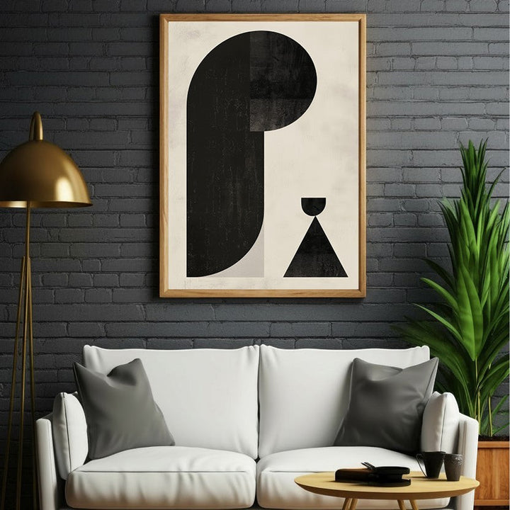 Wadi Home abstract geometric art print with black shapes on a neutral textured background. Framed in light wood.