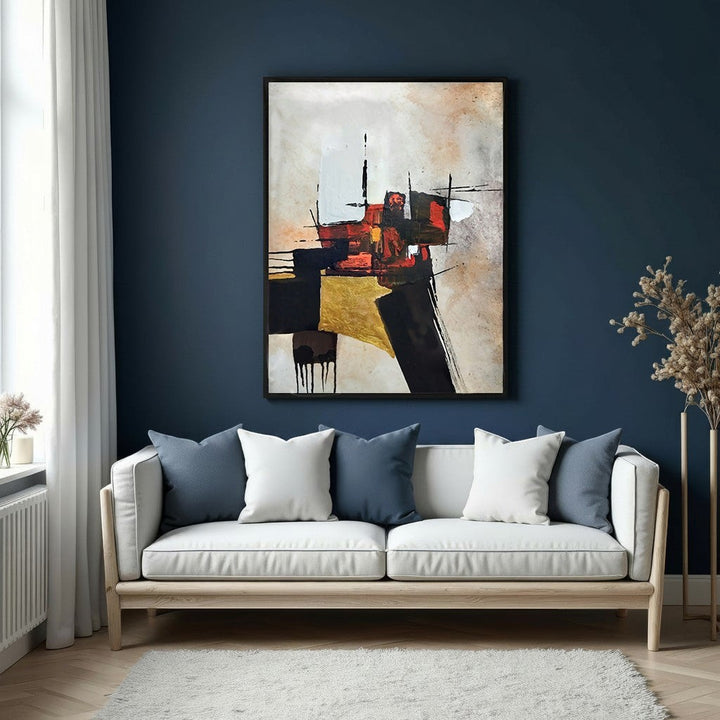 Wadi Home abstract geometric canvas wall art with black, gold, and red hues, displayed above a white sofa.