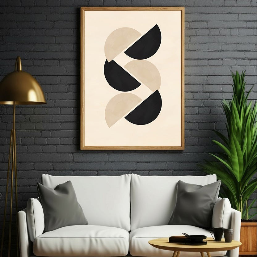 Wadi Home abstract geometric wall art with interlocking black and beige half circles in a light wood frame.
