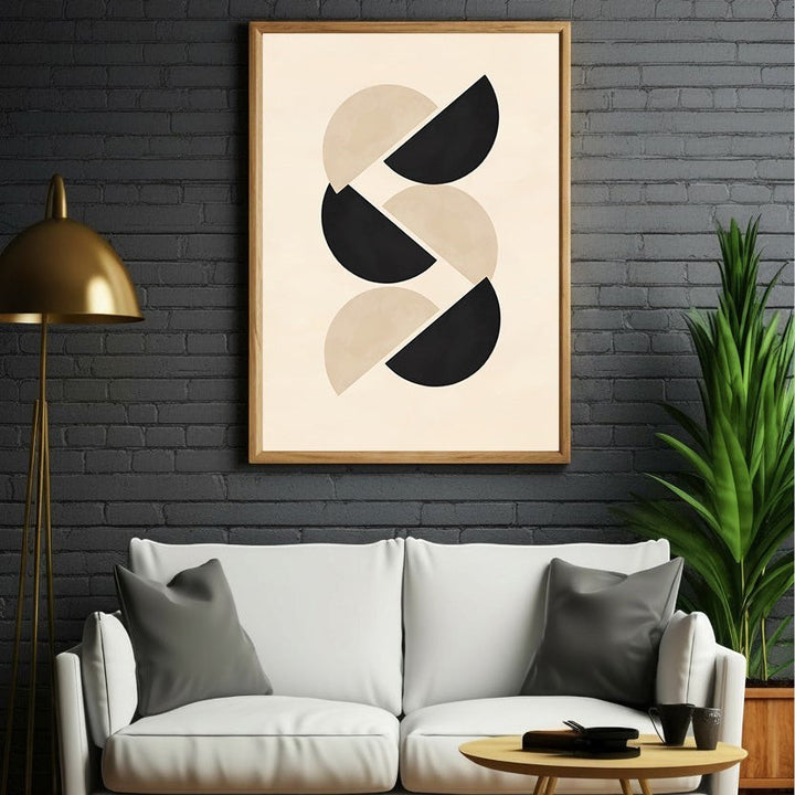 Wadi Home abstract geometric wall art with interlocking black and beige half circles in a light wood frame.
