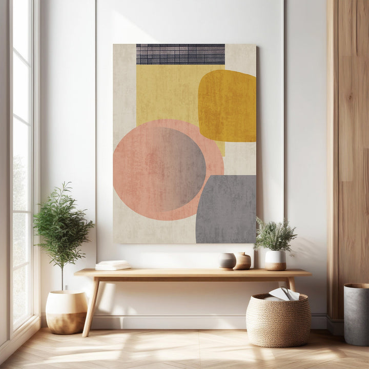Wadi Home abstract geometric wall art with blush pink, mustard yellow, and grey shapes. Modern art for living rooms.