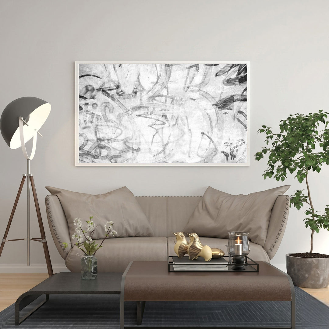 Wadi Home abstract monochrome graffiti wall art with bold lines and textured details, framed in white.