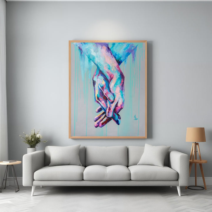 Wadi Home abstract wall art of intertwined hands in vibrant blues, pinks, and purples with dripping paint effect.