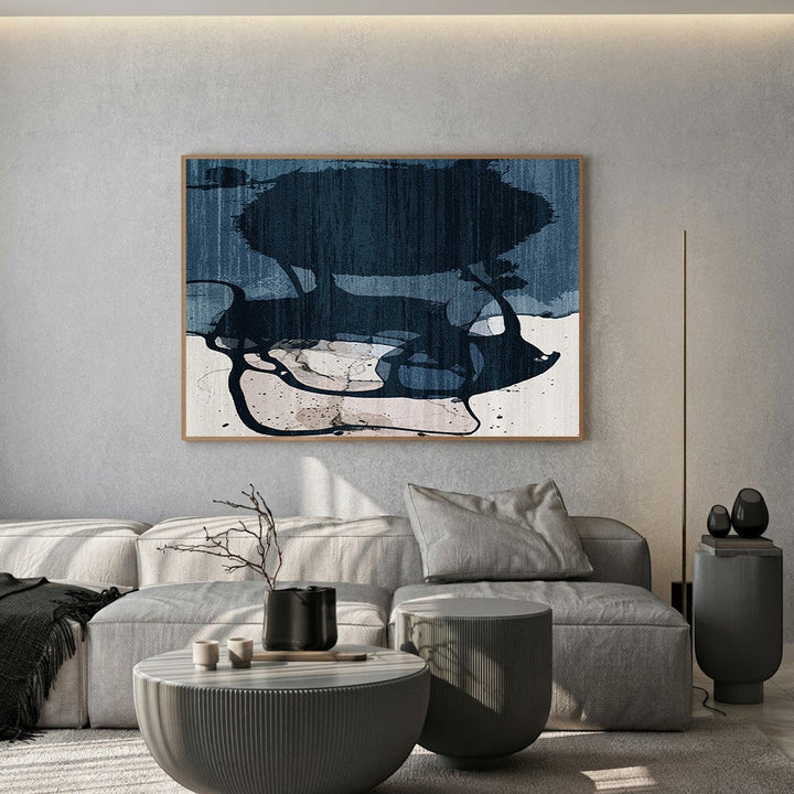 Wadi Home abstract ink wash landscape wall art in deep blues and earthy tones, framed in light wood.