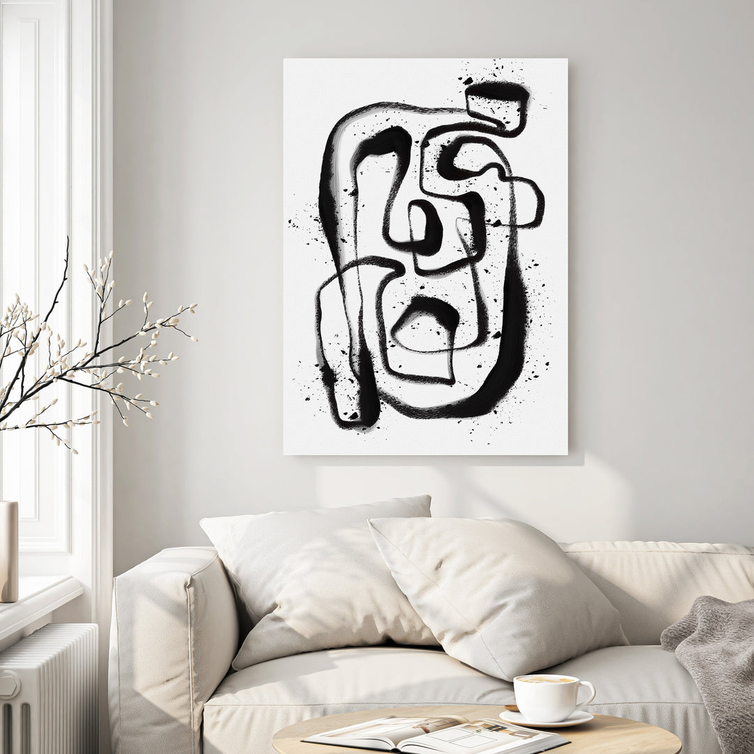 Wadi Home abstract line art canvas print with bold black brushstrokes and spray paint splatters on white background.