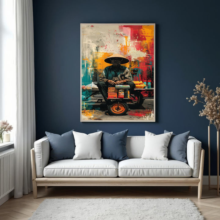 Wadi Home abstract canvas print of a man in a conical hat, seated with goods, against a vibrant red, yellow, and blue background.