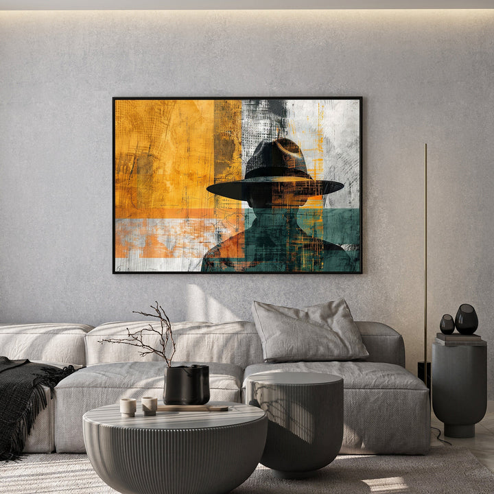 Wadi Home abstract man with hat wall art, featuring a silhouette in warm yellows, teals, and grays.