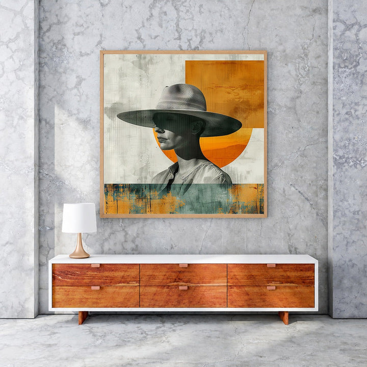 Wadi Home abstract portrait art with figure wearing a wide-brimmed hat, muted tones with orange accents, framed wall art.