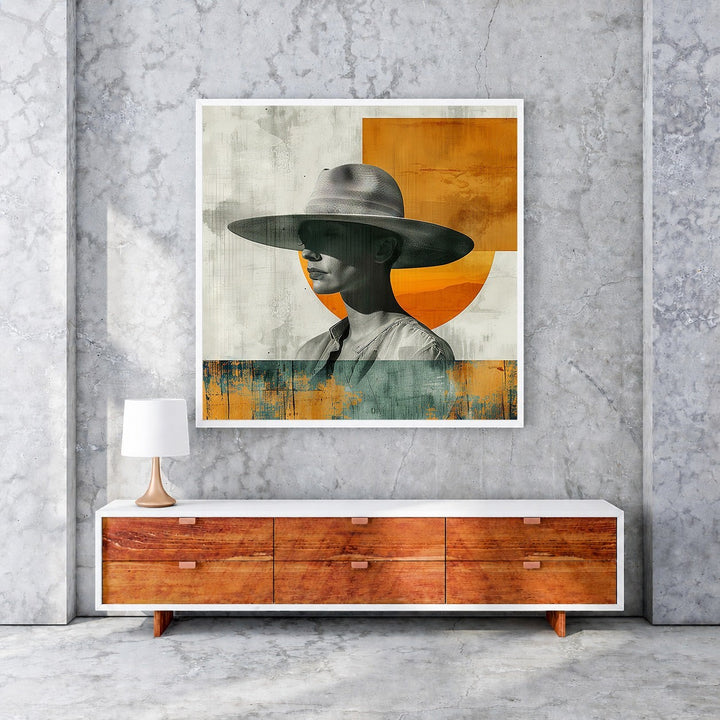 Wadi Home abstract portrait art with a figure wearing a wide-brimmed hat, featuring muted tones and orange accents.