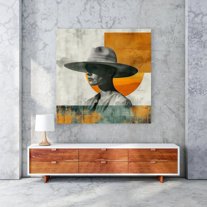 Wadi Home abstract portrait art with a figure wearing a wide-brimmed hat, featuring muted tones with orange and teal accents.