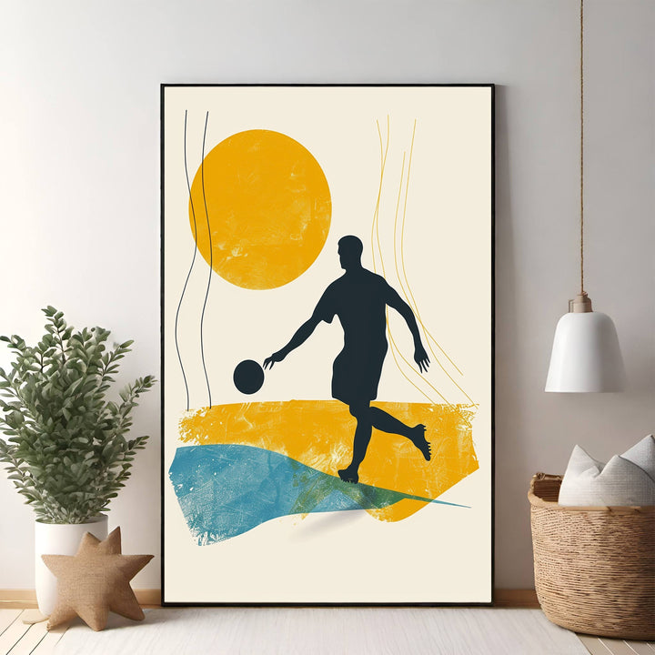 Wadi Home abstract soccer player wall art, featuring a dark silhouette in action against textured yellow and blue shapes.