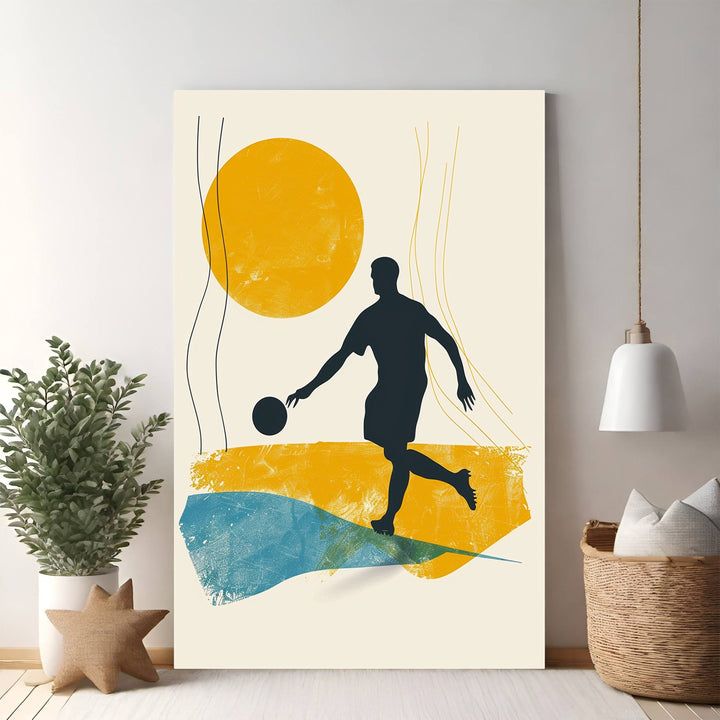 Wadi Home abstract soccer player wall art, dark silhouette in action with yellow sun and blue textured shapes.