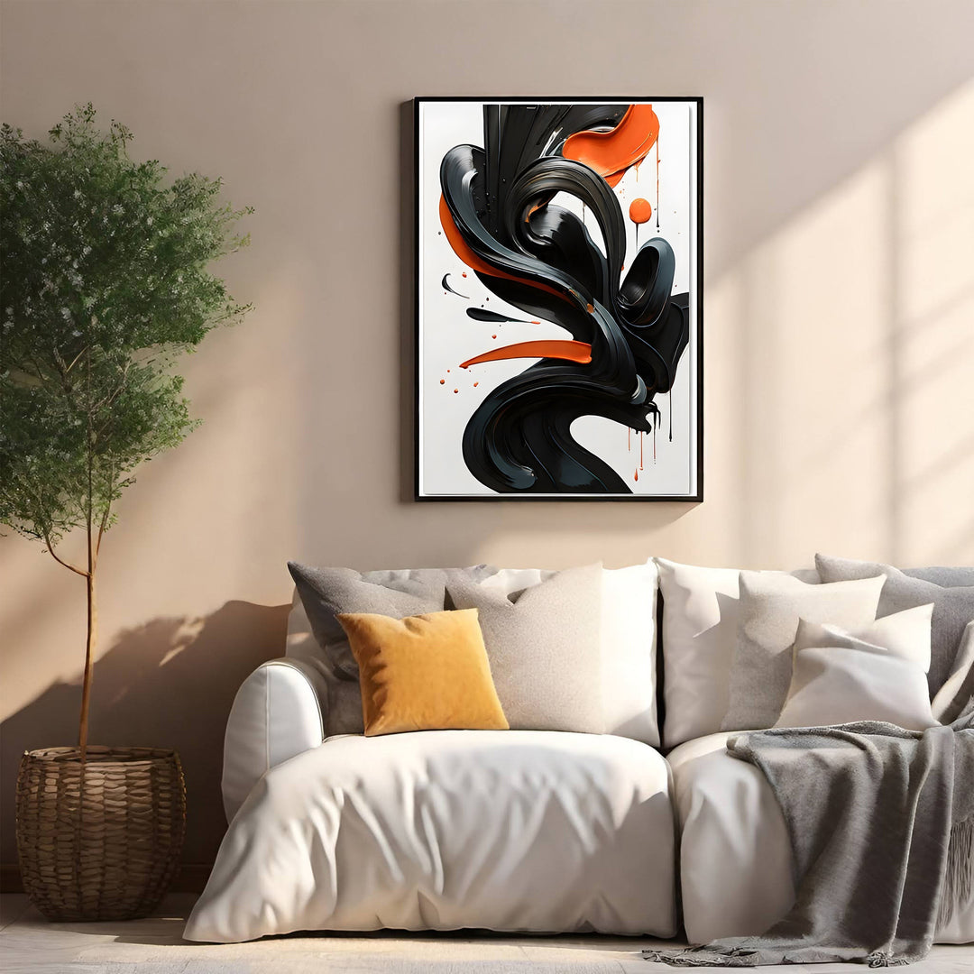 Wadi Home abstract wall art with glossy black and orange swirls, framed in black.