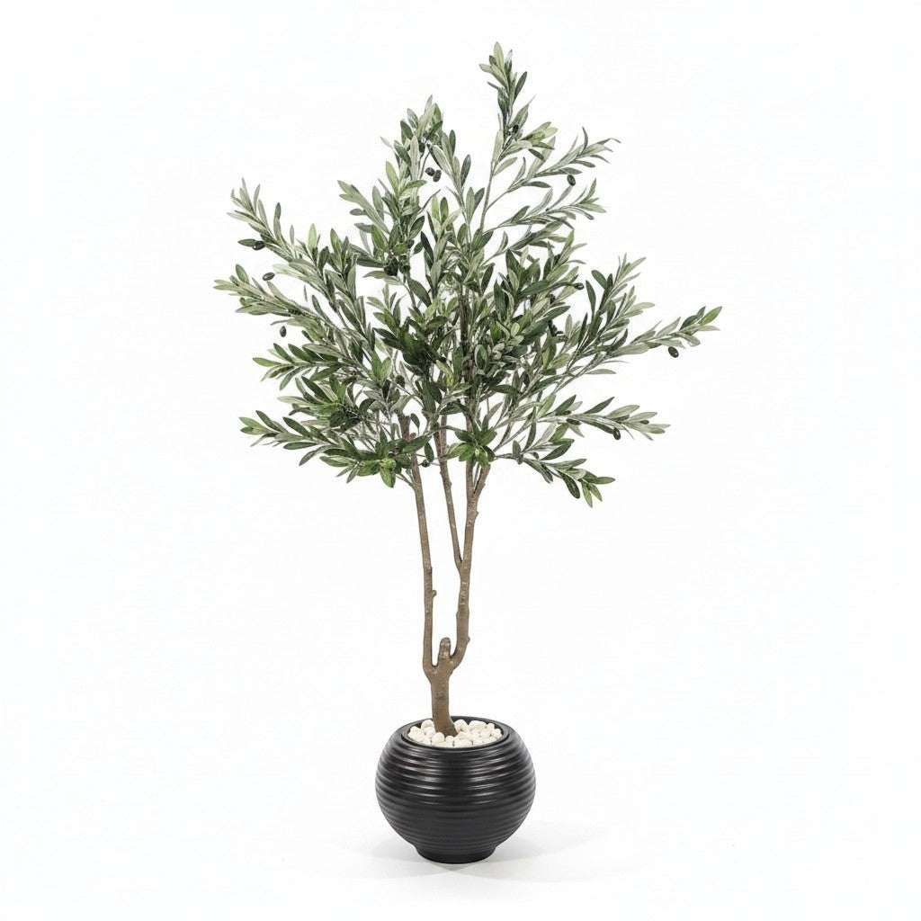 Wadi Home artificial olive tree with green leaves and black olives in a black ribbed pot with white stones.
