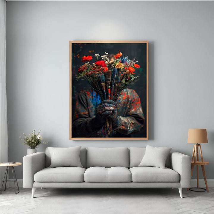 Wadi Home framed wall art of a bouquet of flowers held by an artist wearing paint-splattered clothes.