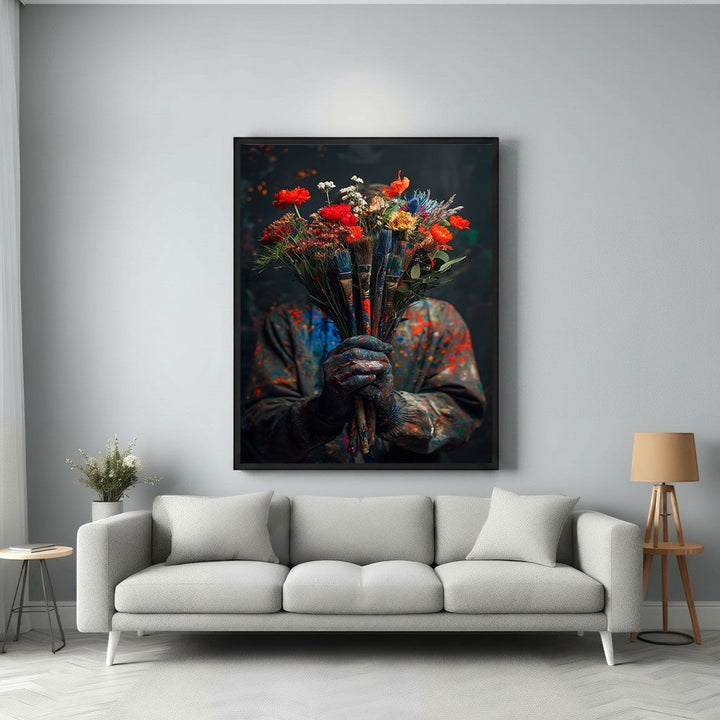 Wadi Home Artist's Bouquet wall art featuring a person in paint-splattered clothes holding a vibrant bouquet of flowers and paintbrushes.