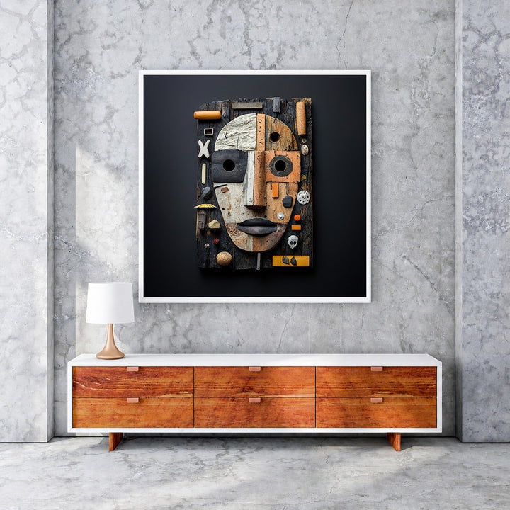 Wadi Home Assemblage Face Wall Art, a textured sculpture of a face made from reclaimed wood, metal, and found objects in neutral tones with rust and ochre accents.