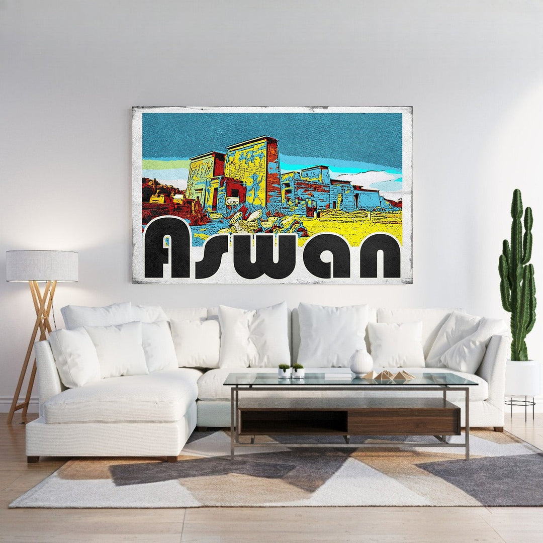 Wadi Home Aswan vintage postcard wall art featuring Egyptian architecture in vibrant yellow, blue, and red with bold black lettering.