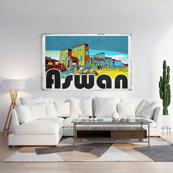 Wadi Home Aswan vintage postcard wall art featuring Egyptian architecture in vibrant yellow, blue, and red with bold black lettering.