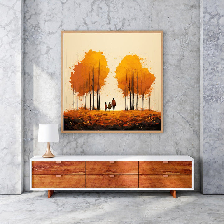 Wadi Home autumn trees wall art with family silhouette walking on fallen leaves, warm golden hues.