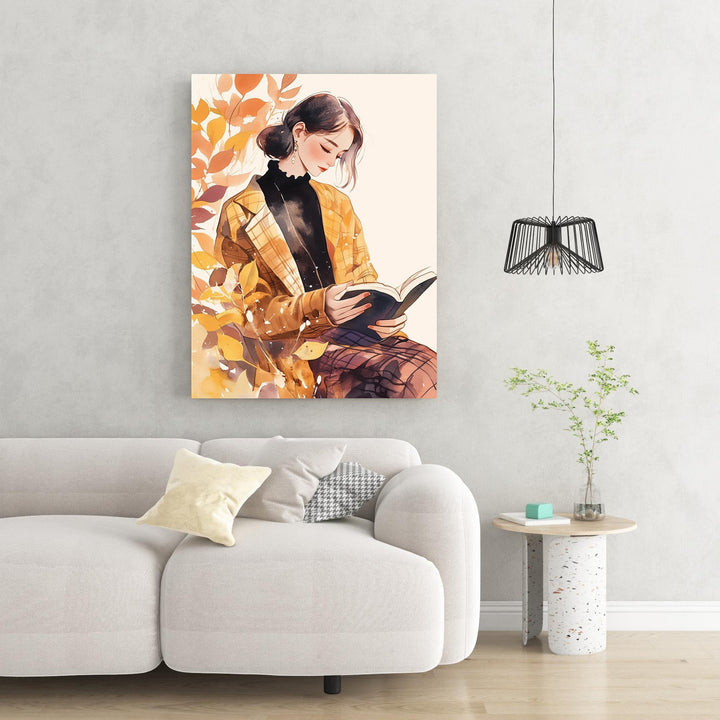 Wadi Home watercolor art of a woman in a plaid jacket reading a book, surrounded by autumn leaves.
