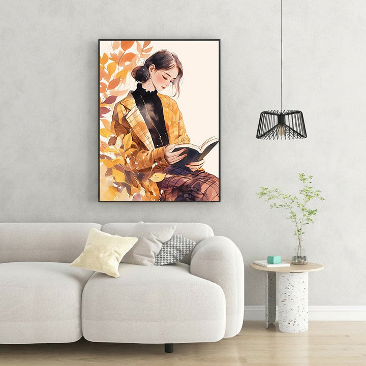 Wadi Home autumn reading woman watercolor art print with woman in plaid jacket reading a book, surrounded by fall leaves.