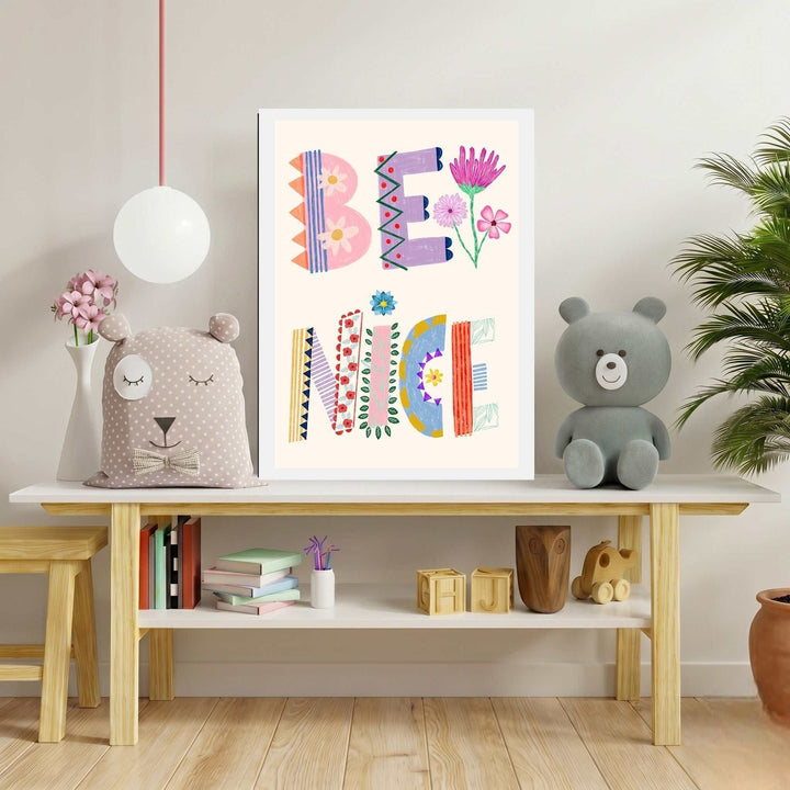 Wadi Home Be Nice typography art print with colorful, patterned letters and floral accents, perfect for a child's room.