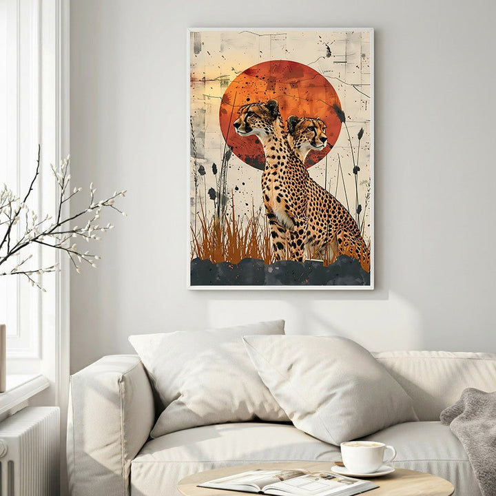 Wadi Home cheetahs in savannah sunset wall art. Two cheetahs silhouetted against a textured orange sunset.