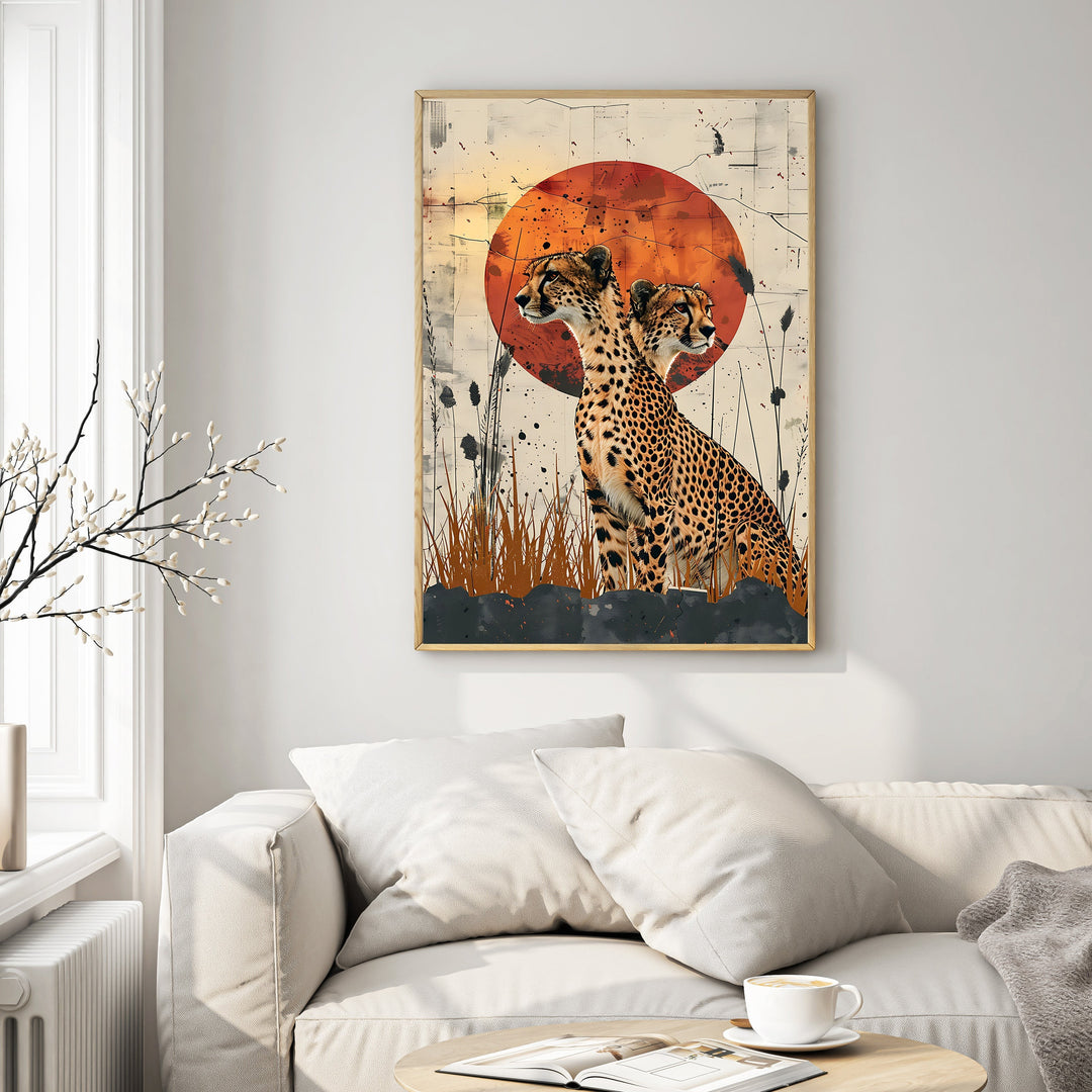 Wadi Home cheetahs in savannah sunset wall art, featuring two cheetahs silhouetted against a textured orange sun and dry grass.