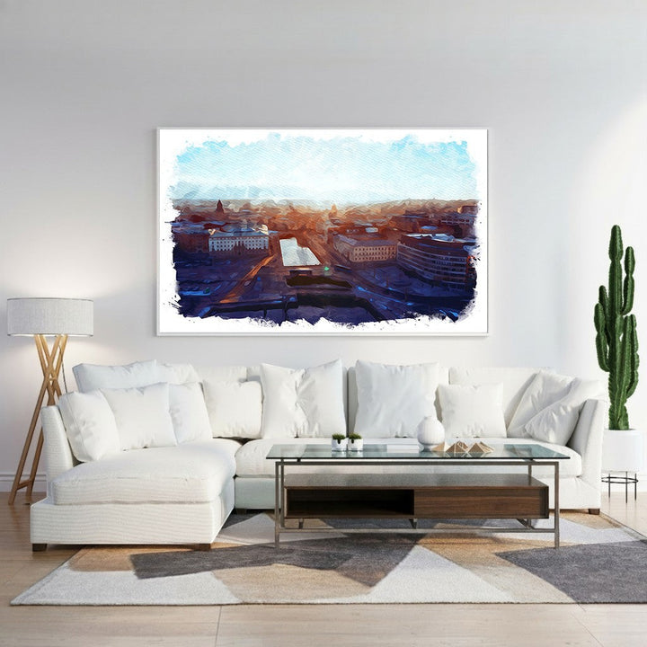 Wadi Home Cityscape Sunrise Watercolor Wall Art featuring a vibrant watercolor depiction of a city at dawn with warm oranges and deep blues.