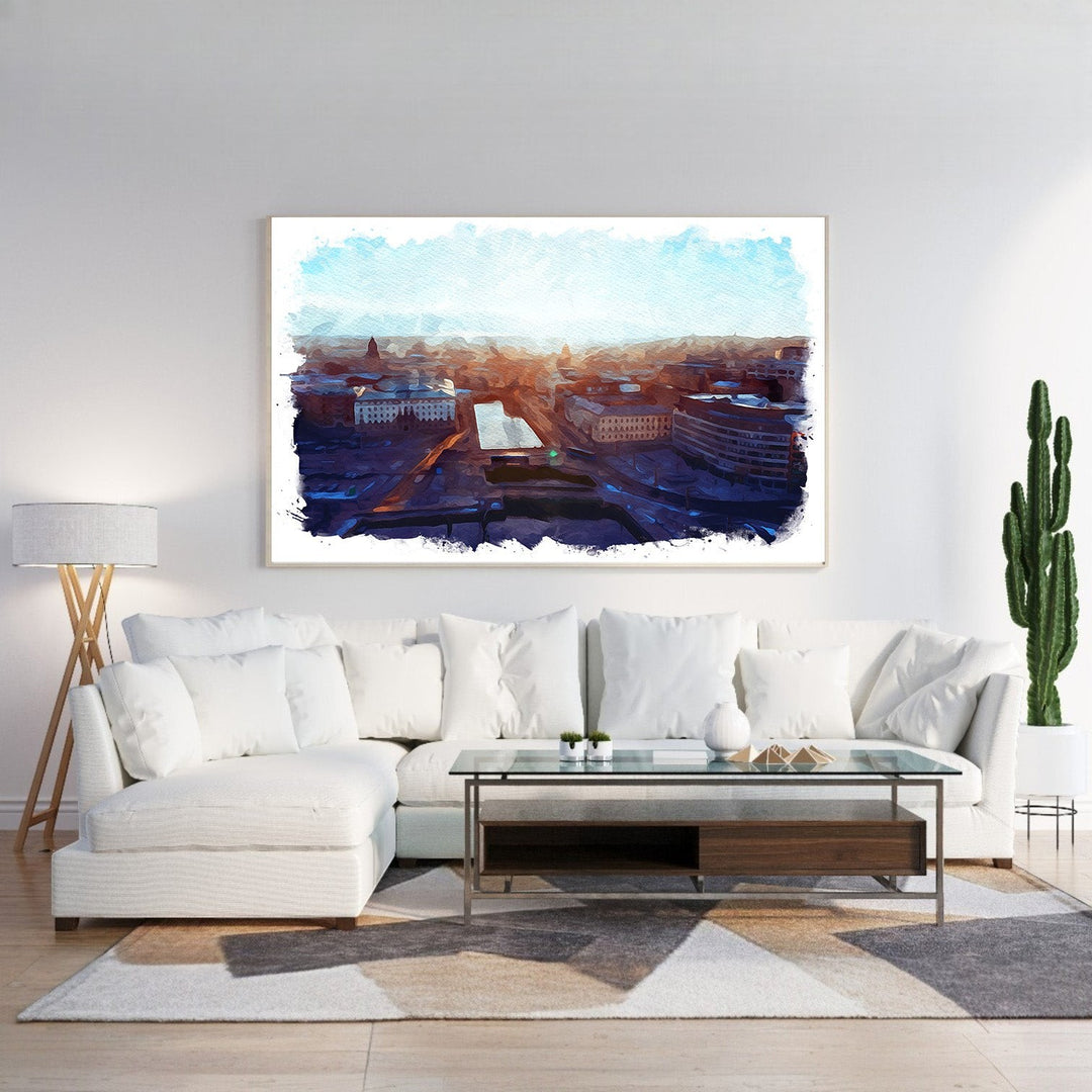 Wadi Home Cityscape Sunrise Watercolor Wall Art featuring a vibrant watercolor depiction of a city at dawn with warm oranges and deep blues.