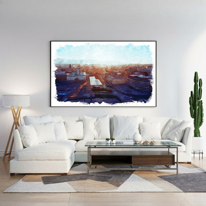 Wadi Home Cityscape Sunrise Watercolor Wall Art featuring a vibrant watercolor depiction of a city at dawn with warm oranges and deep blues.