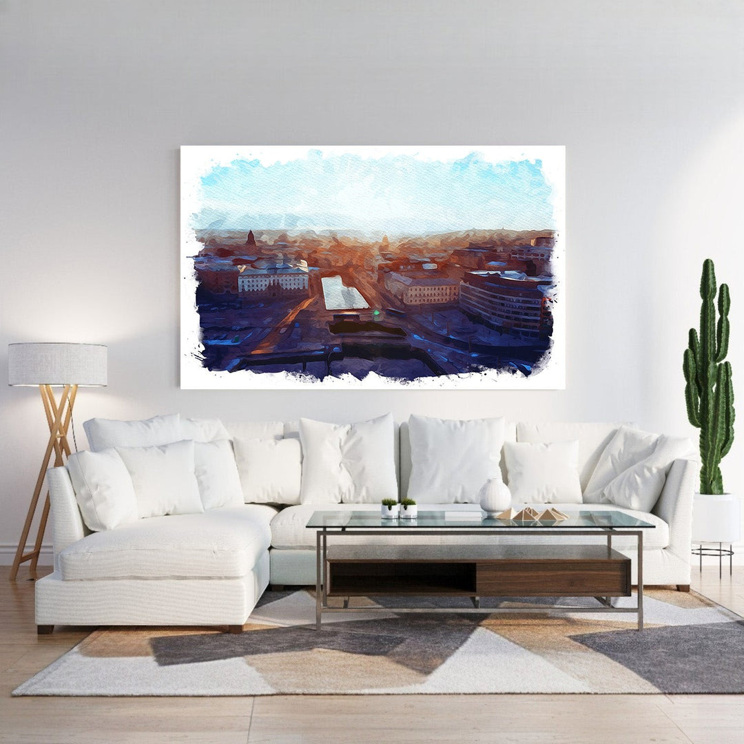 Wadi Home Cityscape Sunrise Watercolor Wall Art featuring a vibrant watercolor painting of a city at dawn with warm oranges and deep blues.