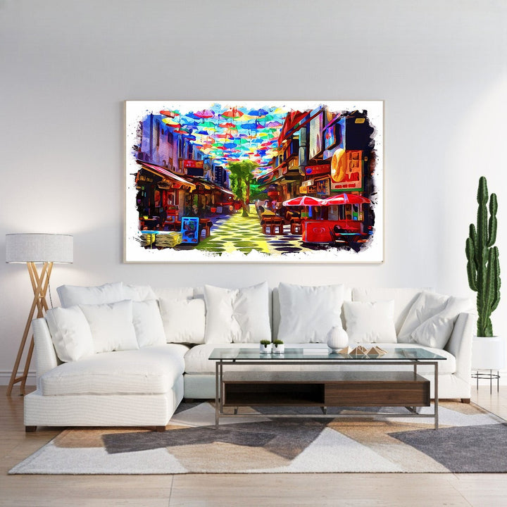Wadi Home canvas print of a colorful street scene with many bright umbrellas overhead and shops lining the street.