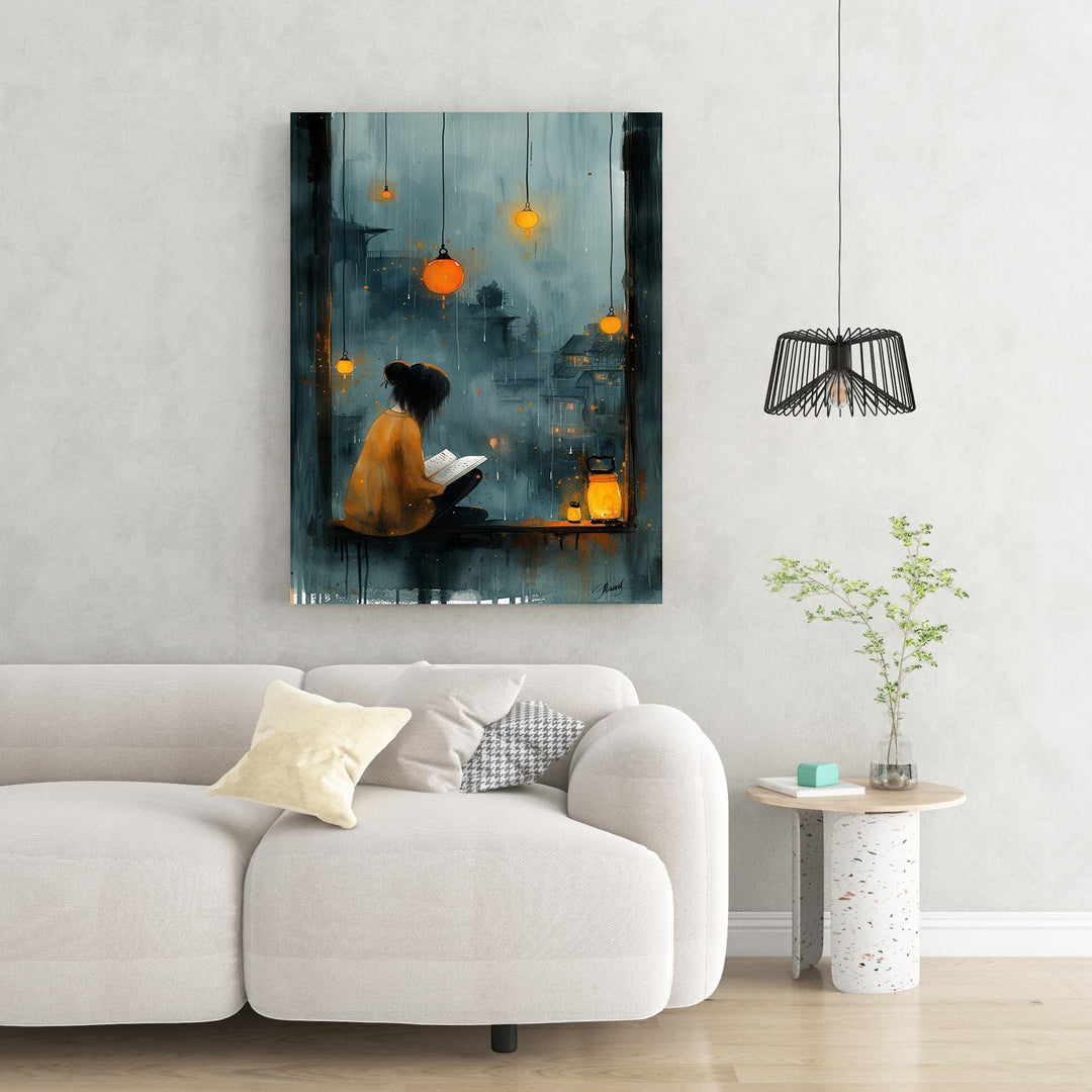 Wadi Home cozy reading nook wall art, woman reading by window overlooking rainy cityscape with lanterns, moody blues and orange accents.