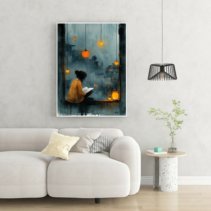 Wadi Home cozy reading nook wall art, woman reading by window on rainy night with lanterns