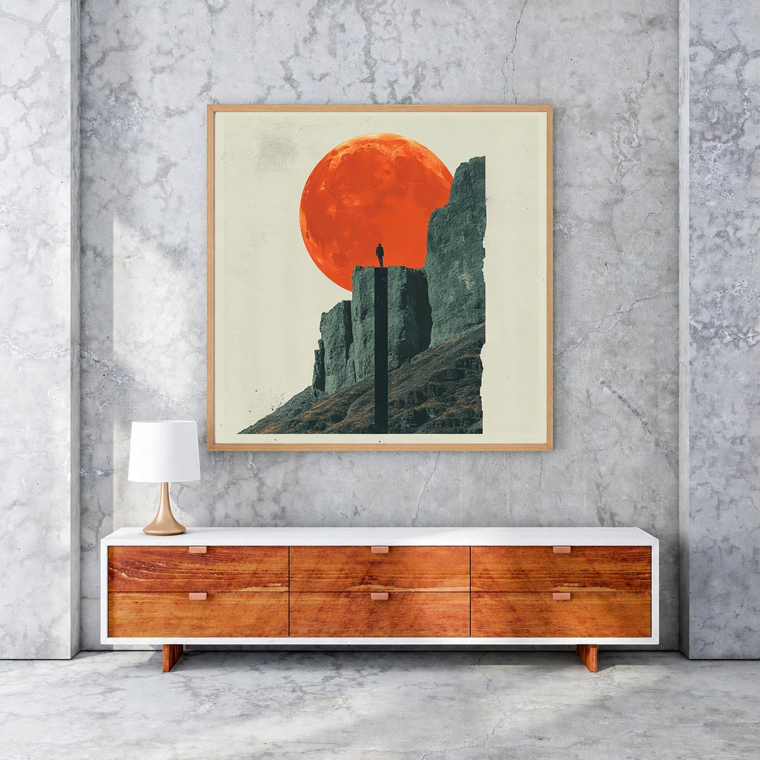 Wadi Home 'Solitude Under The Crimson Moon' framed art print. Lone figure on mountain peak under large crimson moon.