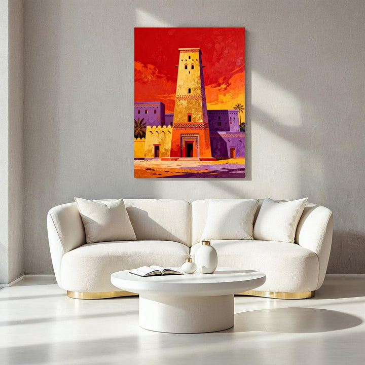 Wadi Home Desert Oasis Tower Art Print featuring a tall, yellow tower against a vibrant red and orange sunset sky with purple buildings.
